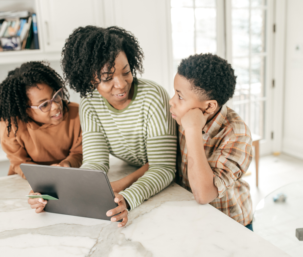 Mom teaching her two kids basic money lessons for financial literacy