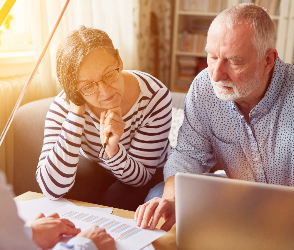 A senior couple discussing their finances and senior safety