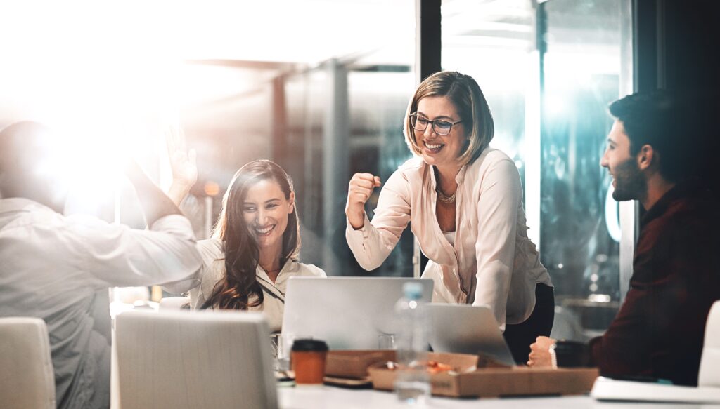Coworkers celebrating women in finance