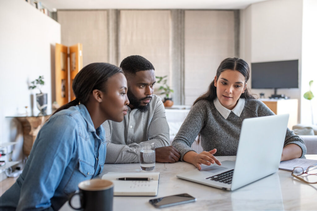 Three coworkers discussing retirement planning for women