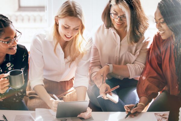 four women discussing financial planning for women over coffee