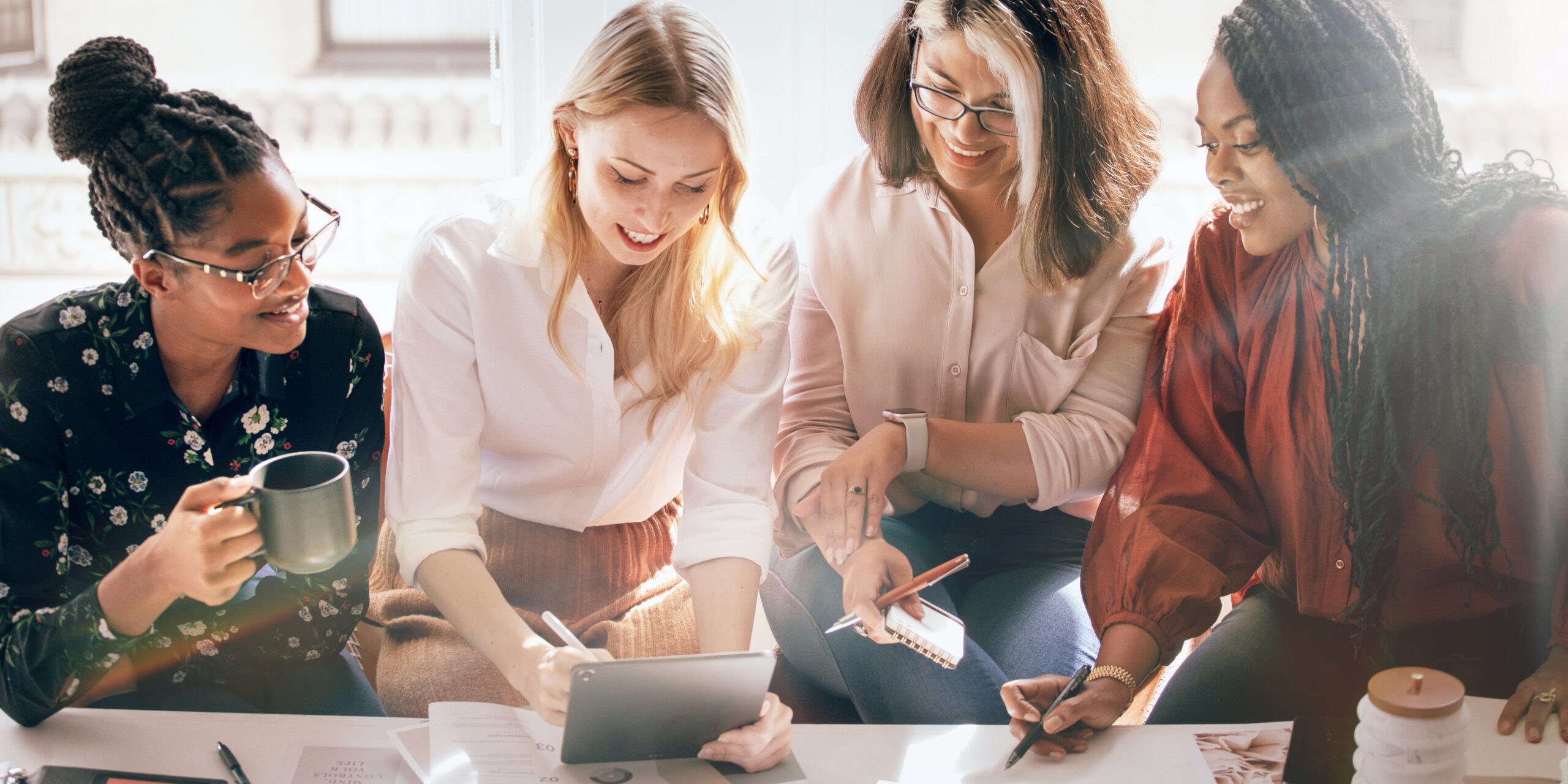 four women discussing financial planning for women over coffee