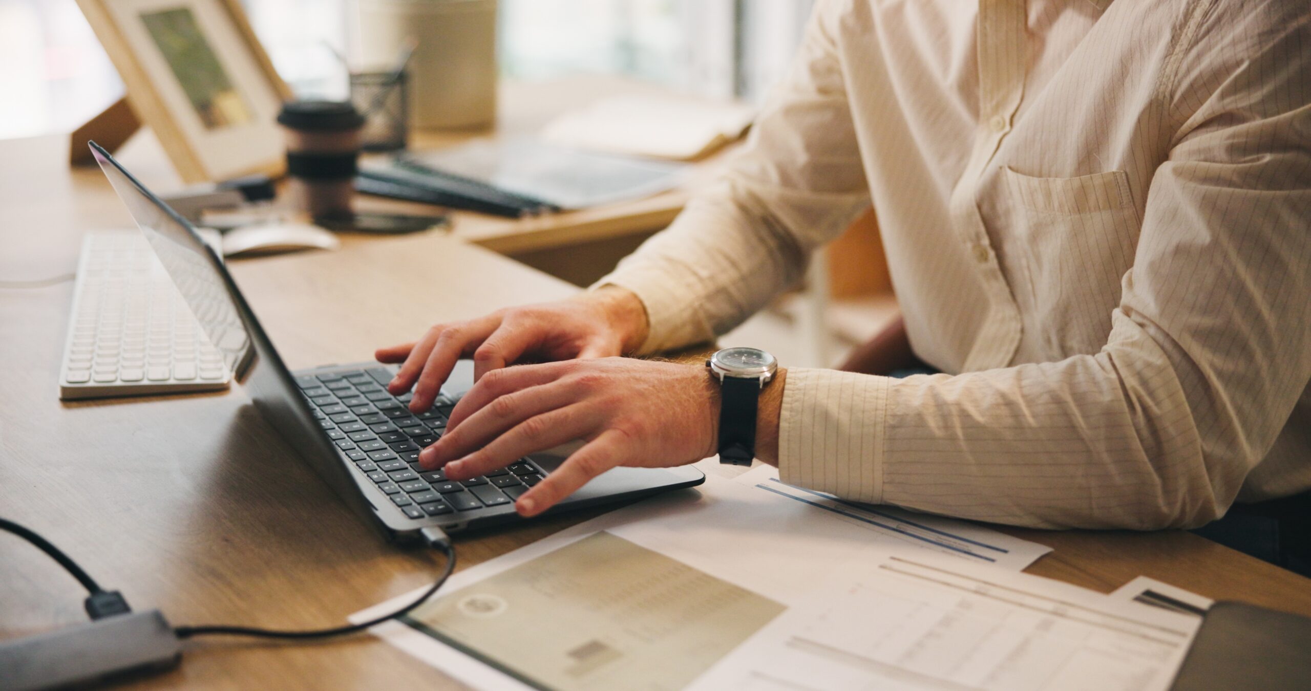 a person typing on a laptop on a blog about tax planning