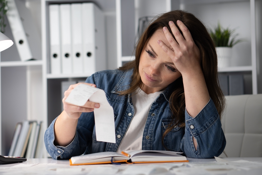 A woman frustrated and experiencing financial stress