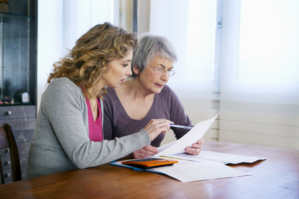 A daughter and her aging mother discussing how to care for aging parents